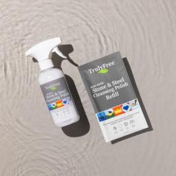 Truly Free Home Stone & Steel Cleansing Polish Spray bottle and 1 refill pack.